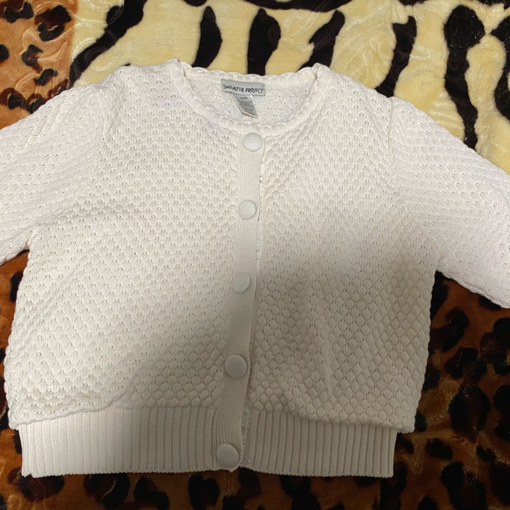 White sweater from Sweater Project